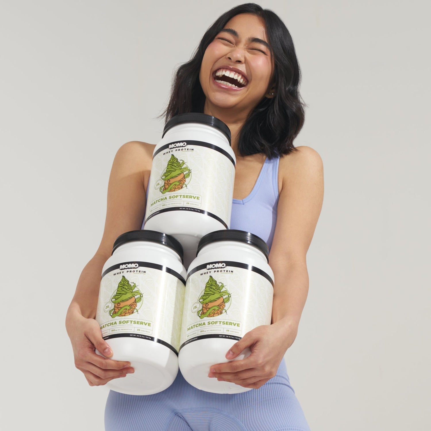 Girl holding MOMO whey protein