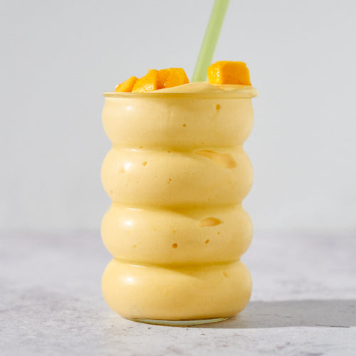 MOMO protein mango lassi smoothie topped with mango chunks